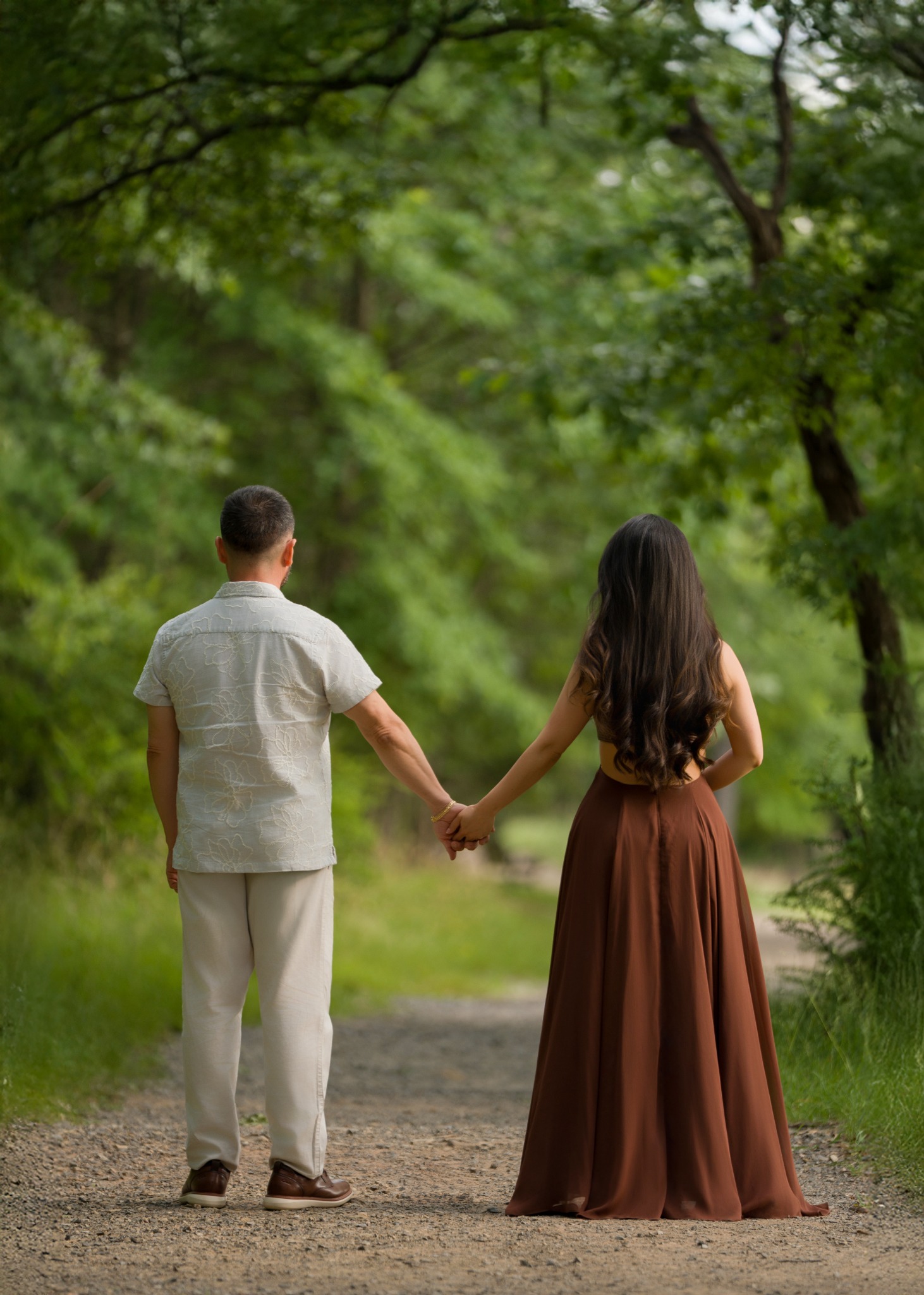 Karem and Eduardo walking hand in hand toward their next chapter