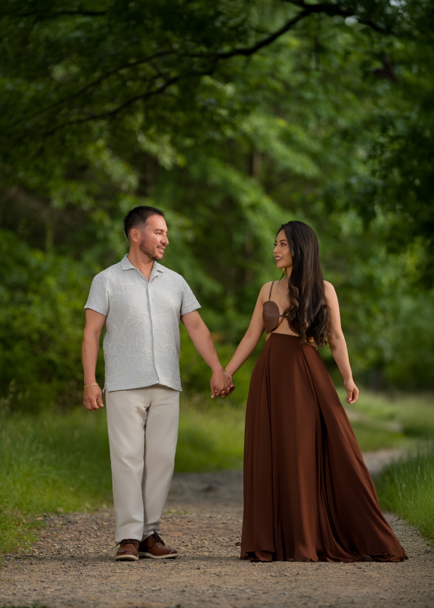 Karem and Eduardo holding hands during their engagement session